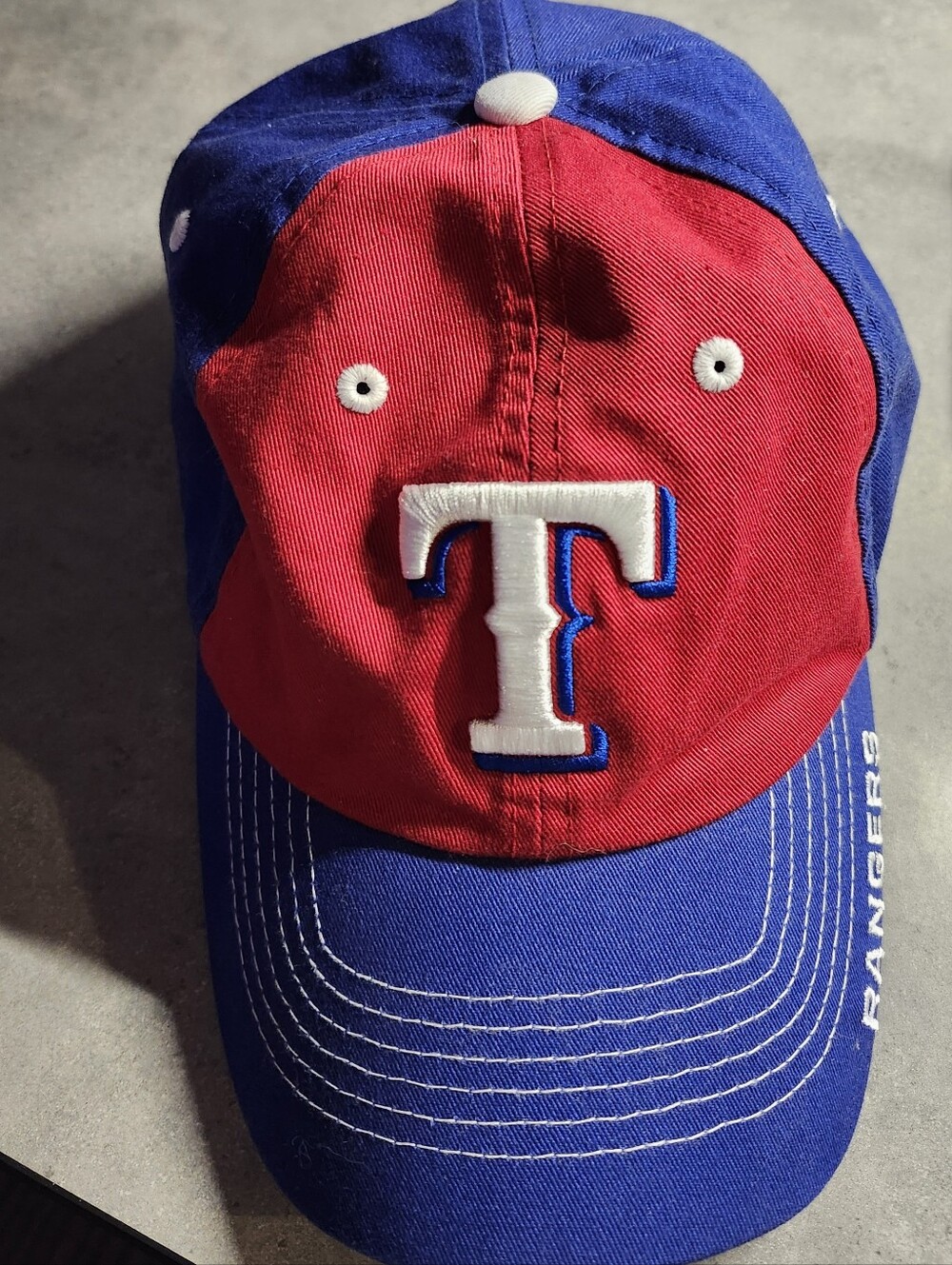 Texas Rangers blue baseball cap. One size fits all. Unisex.